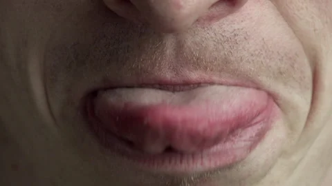 Man Touches His Nose With His Tongue Stock Footage