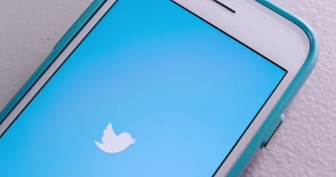Man touches Twitter app to open it from App Store on iPhone Stock Footage 156795464