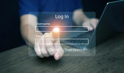 A man touches a virtual login interface with username and password fields. .. Stock Photos