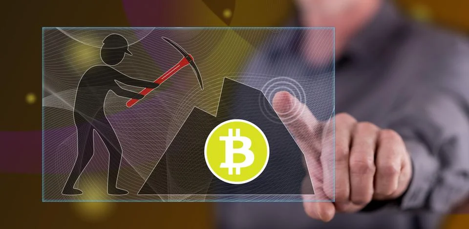 Man touching a bitcoin mining concept Stock Photos