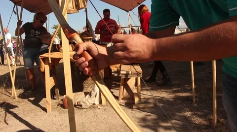 Man is touching bow and bowstring Stock-Footage 56279538