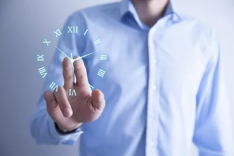Man touching clock in screen Stock Photos