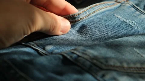 Man touching denim to the touch, close-up Stock Footage 221174108
