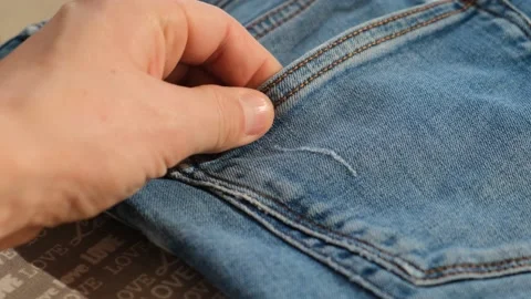 Man touching denim to the touch, close-up Stock Footage 221174333