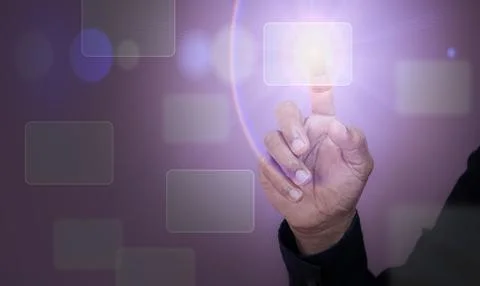 Man touching digital virtual buttons on hologram screen with his finger Stock Photos