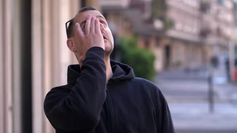 Man touching face after forgetting something important Stock Footage 318583504