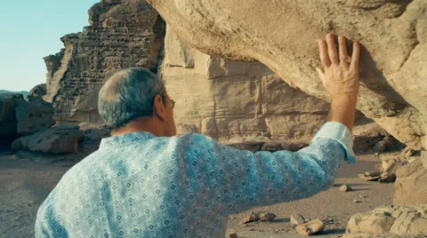 A man touching gorgeous cliffs at the seashore, close shooting 動画素材 44877028