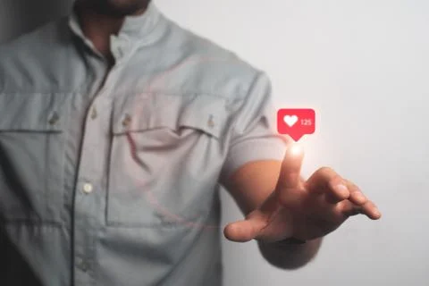 Man touching imaginary screen with his finger. Put like in social networks, Foto stock