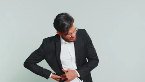 Man touching injured sore back, backache, suffering lower lumbar discomfort Stock Footage 284567890