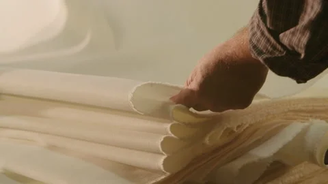 Man touching a new fabric Stock Footage 143774078