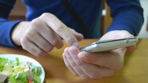 Man touching phone screen in cafe Stock Footage 44982351