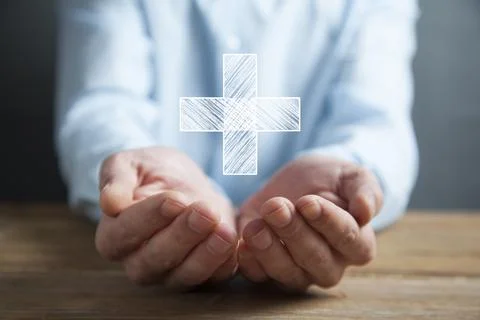 Man touching plus or cross sign in screen Stock Photos