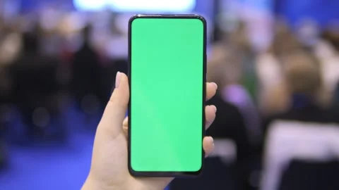 Man is touching a screen with his finger while holding a cell phone Stock Footage 299881066