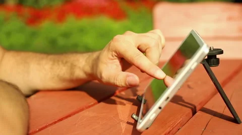Man is touching screen of tablet Stock Footage 65819393