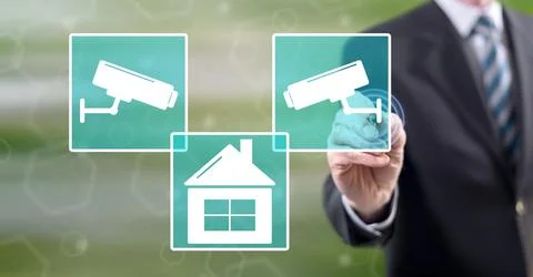 Man touching a security camera concept Stock-Fotos