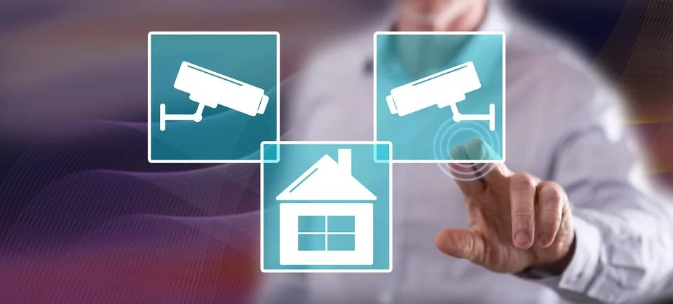 Man touching a security camera concept Stock Photos
