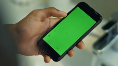 Man touching smartphone with chroma key green screen. Mobile phone Stock Footage