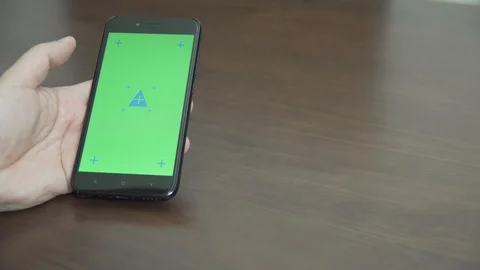 Man Touching Smartphone With Chroma Key Green Screen. Mobile Phone Vídeos de archivo 129854065