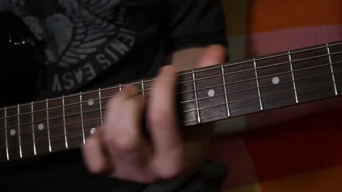 Man is touching the strings and do accords Stock Footage 71091566