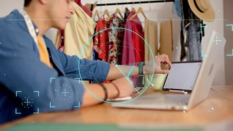 Man touching tablet and activating HUD overlays, writing design notes, checking Vídeo Stock 333609925
