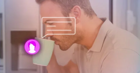 Man touching tablet revealing tech chat bubble while reading messages and Stock Footage 311604769