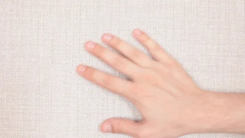 Man touching textured wallpaper on the wall Stock Footage 93161660