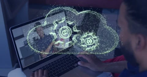 Man touching trackpad and making holo cloud with rotating gears, obscuring Stock Footage 329594110