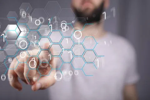 Man touching the virtual tech transparent hexagonal grid with his fingers. Codin 스톡 사진