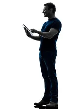 Man touchscreen digital tablet  silhouette Stock Photos