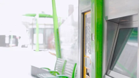 Man tourist tries type touchscreen display to buy a ticket for bus on street Video stock 92118598
