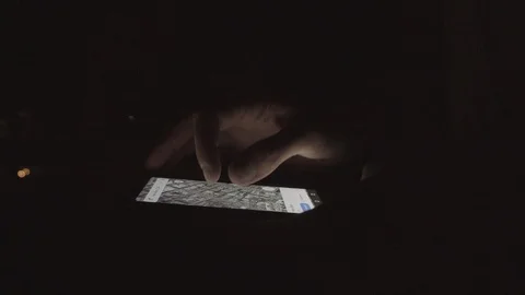 Man tourist using map application on smartphone in night city Stock Footage