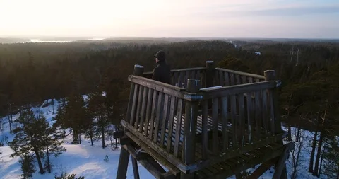 Man in a tower, Cinema 4k close view around a young male on the top of a watc Stock Footage 86297553