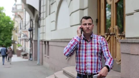 Man in the Town Talking on the Phone Stock Footage 63546889