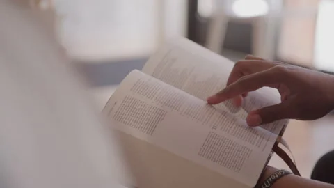 Man Traces Holy Scriptures with His Finger as He Reads Stock Footage 208802034
