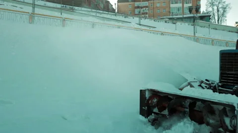A man on a tractor cleans the road from snow. Close-up Stock Footage 59556291