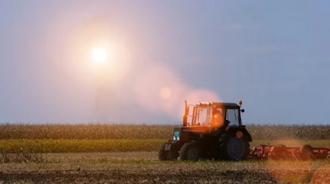 Man in tractor preparing land for sowing Stock Footage 58401120