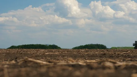 Man on a tractor works in the field Stock Footage 129672589