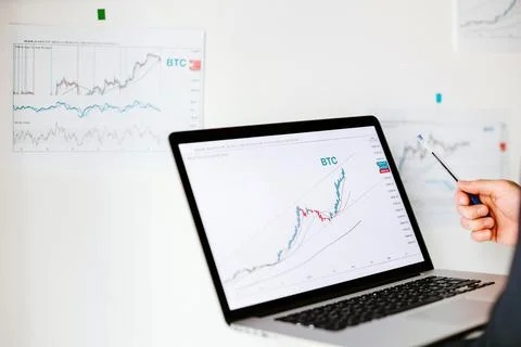 Man trader bitcoin data price trend analysing Stock Photos