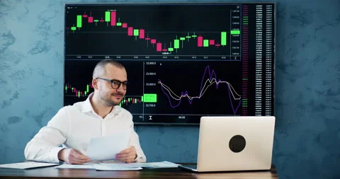 Man trader sees work results and rejoices of done work Stock Footage 241560018