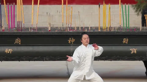 Man in traditional clothes of china practicing Tai Chi in temple Stock Footage 24657900