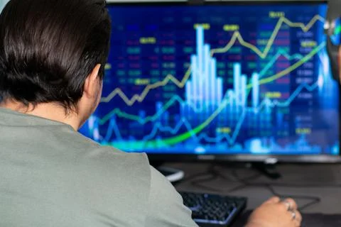 Man traiding on computer Stock Photos