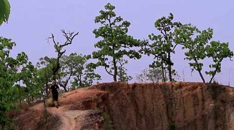 Man trail running in Pai Canyon, Thailand Stock Footage 24263322