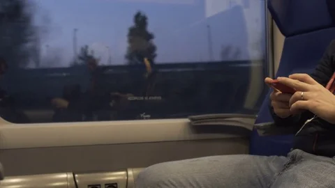 The man on the train is involved in his smartphone Stock Footage 81506241