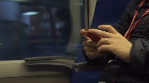 The man on the train is involved in his smartphone Stock Footage 81506601