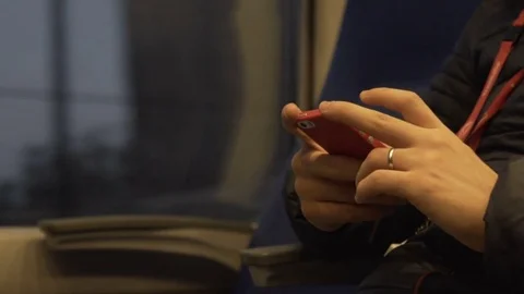 The man on the train is involved in his smartphone. Slow motion Видео 81507646