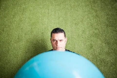 Man training on artificial grass Stock Photos
