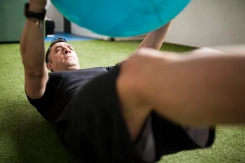 Man training on artificial grass Stock Photos