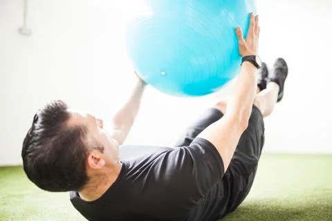 Man training on artificial grass Stock Photos