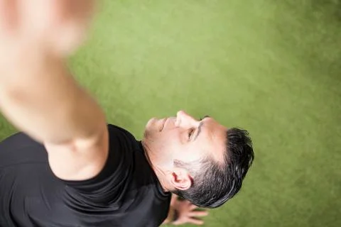 Man training on artificial grass Stock Photos