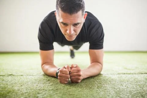 Man training on artificial grass Stock Photos